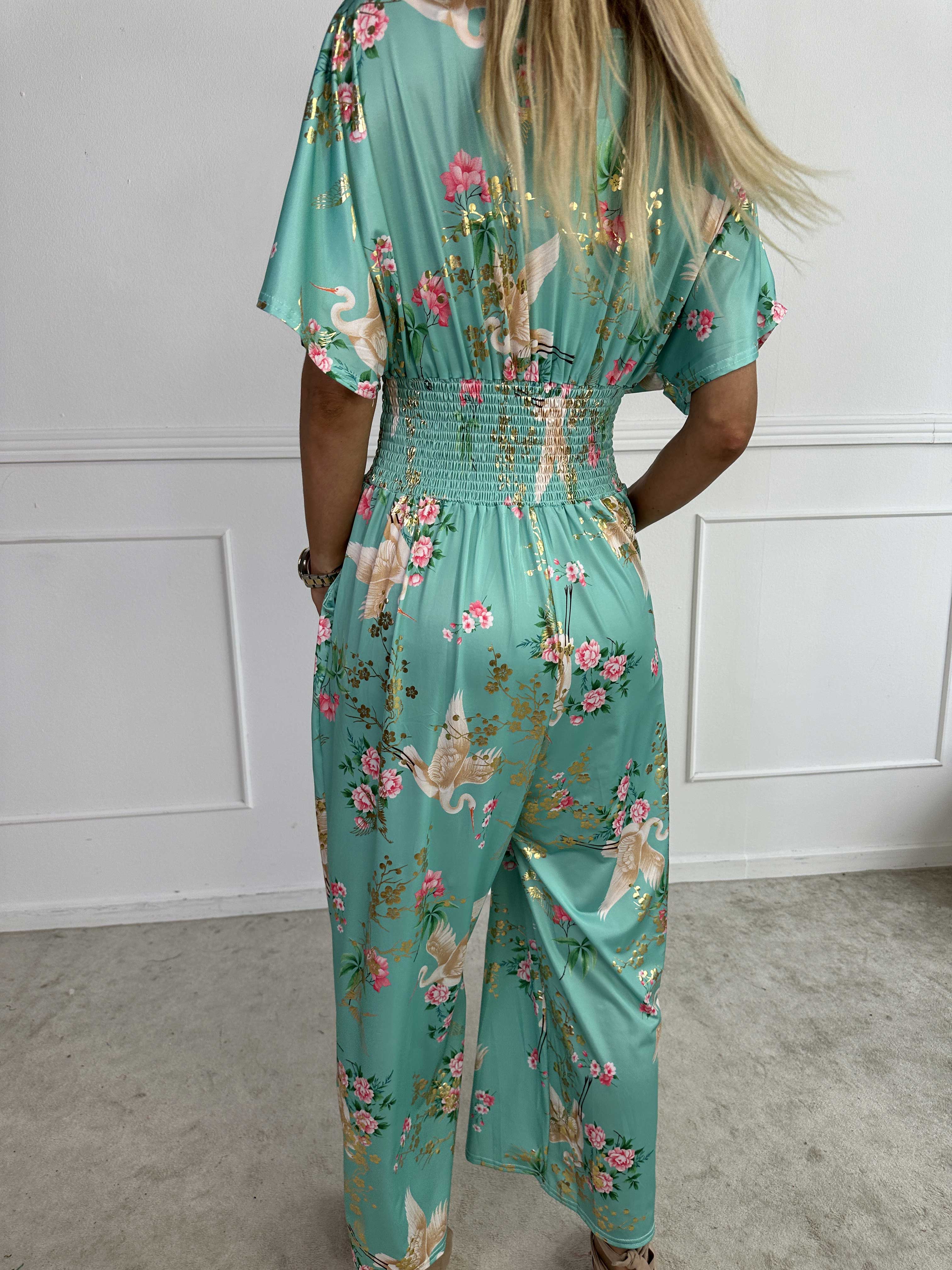 Pams Fly Jumpsuit - Elastisk buksedragt med blomster- og fugleprint
